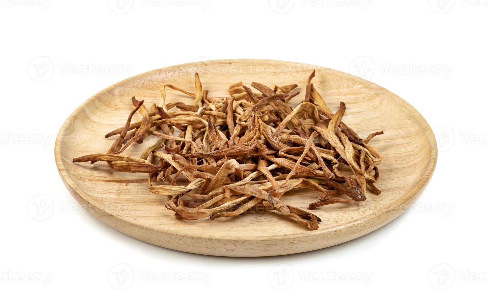 day lily or Hemerocallis lilioasphodelus in wooden dish isolated on white background photo