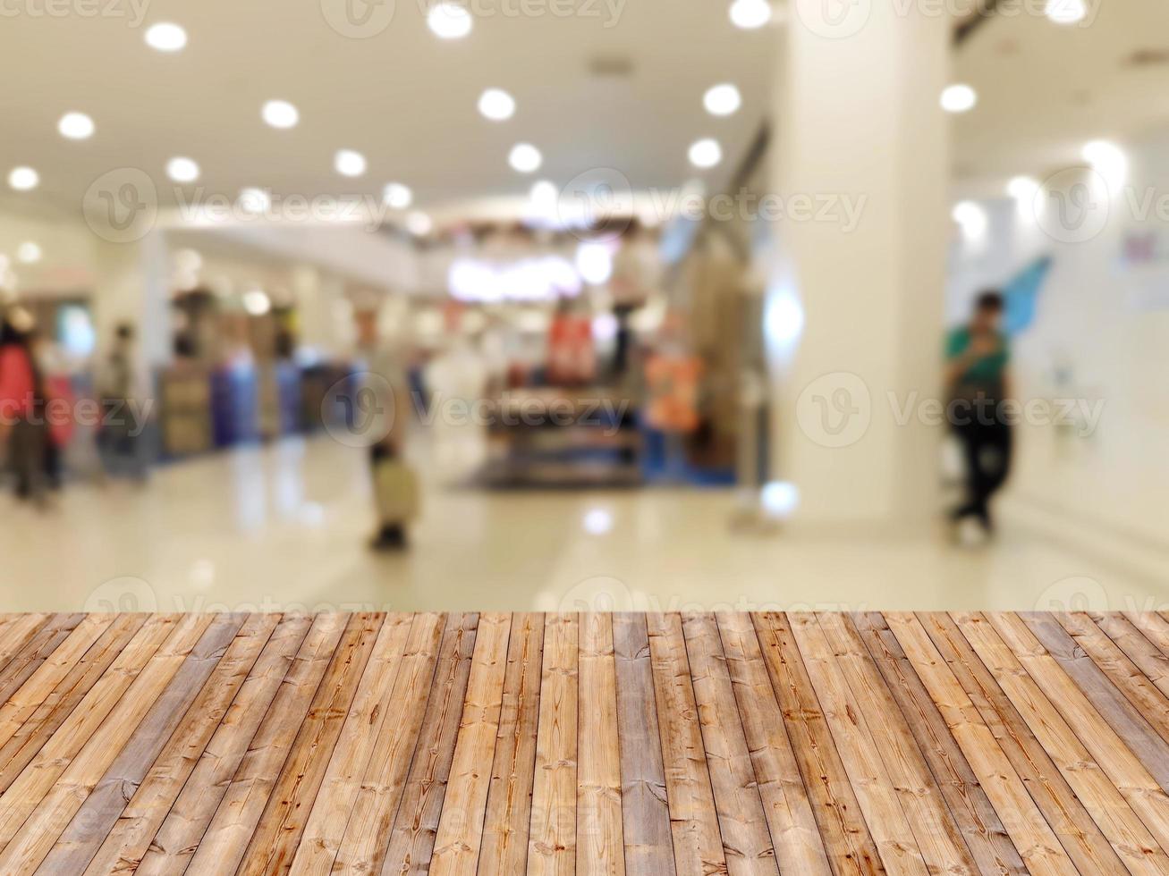 Wooden table with shopping mall blurred background 10752074 Stock Photo
