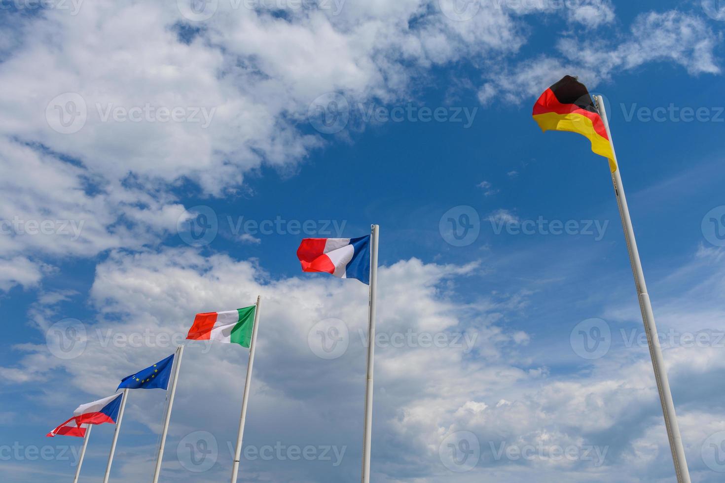 Various flags waving in the wind photo