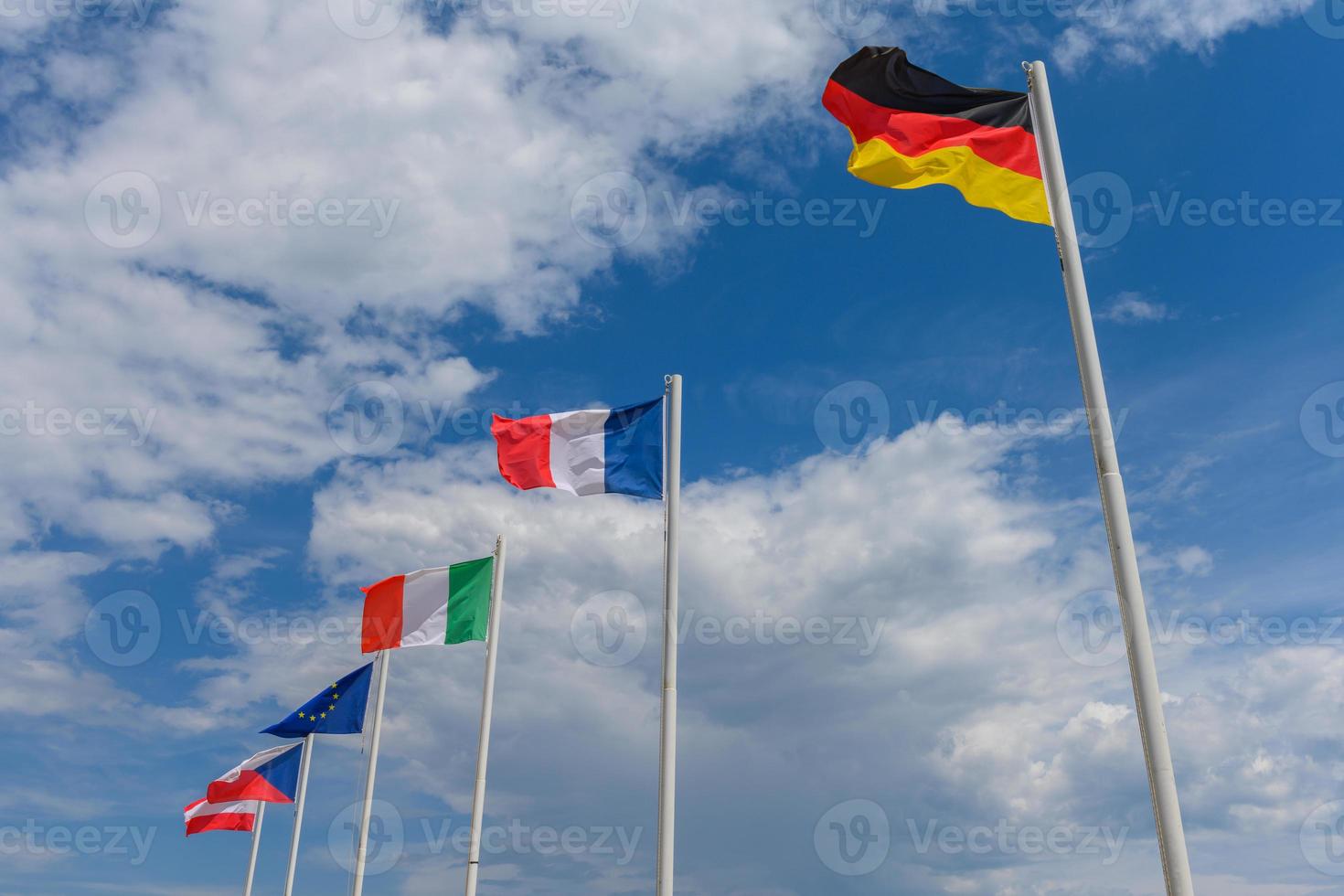Various flags waving in the wind photo