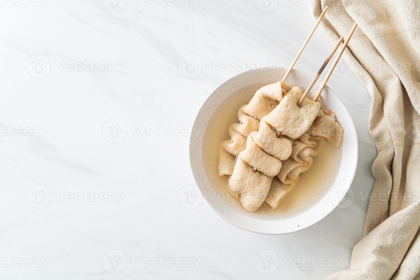 Odeng - Korean fish cake skewer in soup photo
