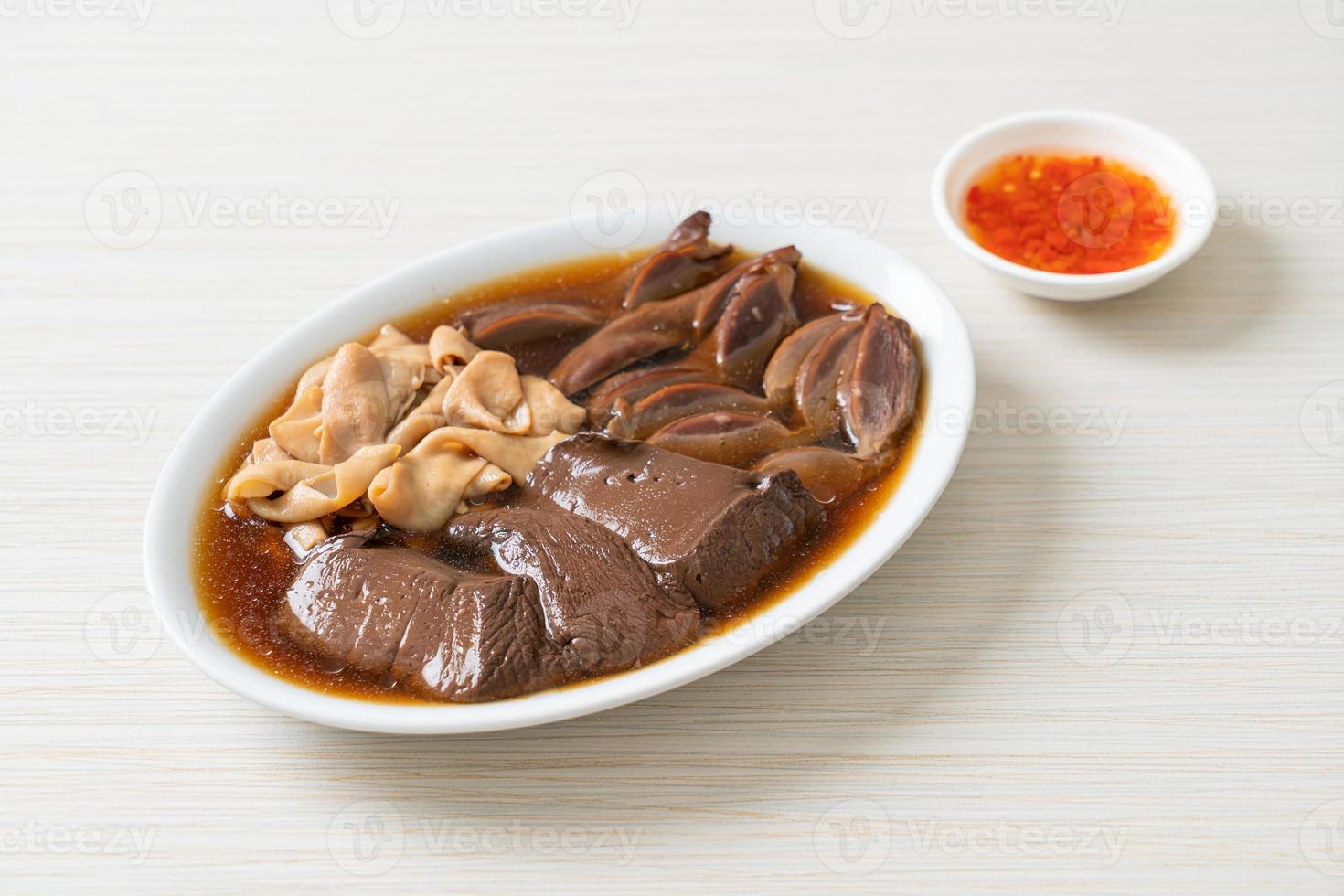 stewed duck offal in brown soup photo
