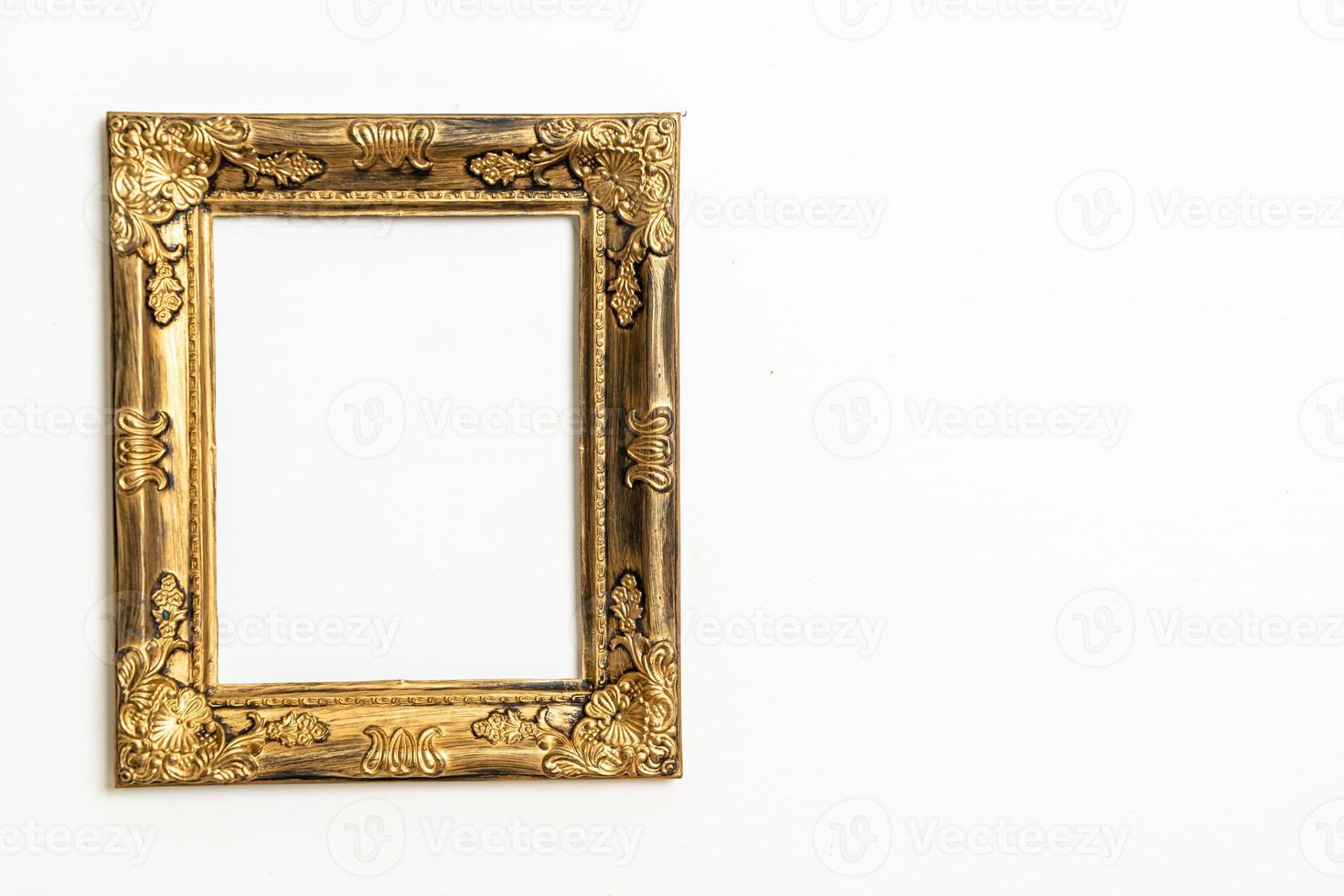 empty picture frame on white wall background photo