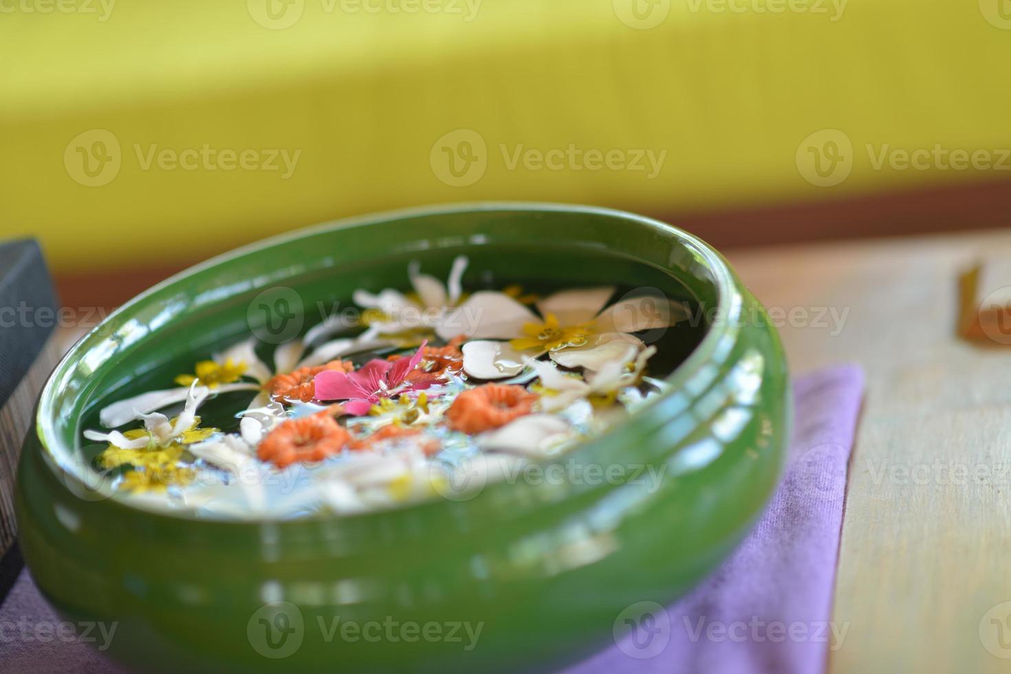 water cup with beautiful flowers background photo