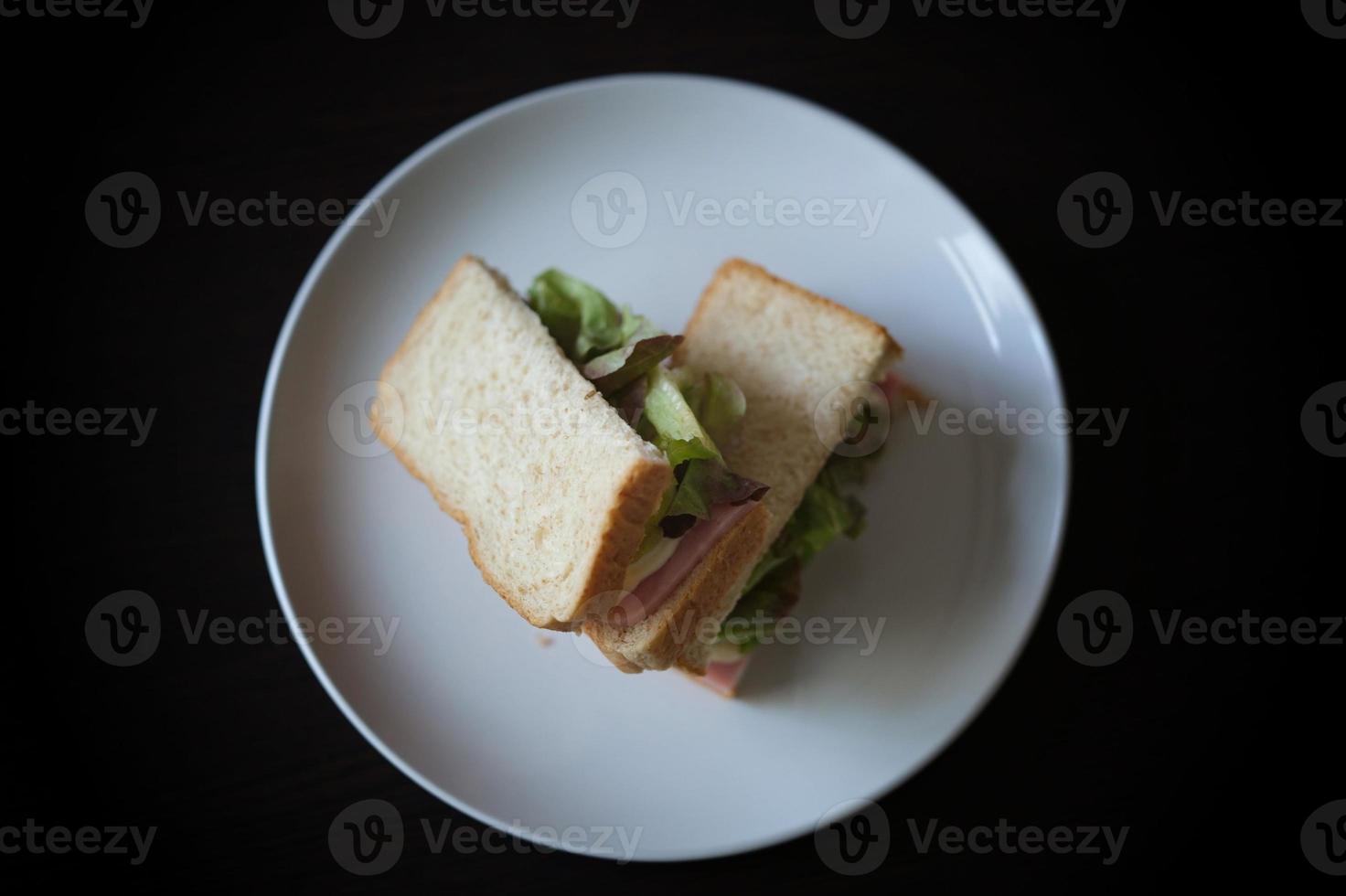 Sandwiches with egg, ham and toast cheese fried in white dish photo