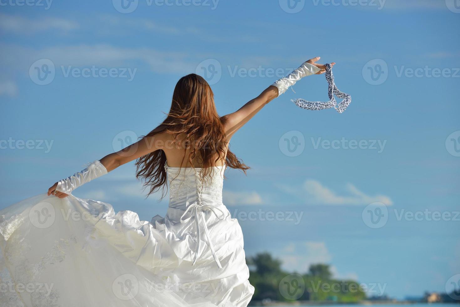 asian bride on beach photo