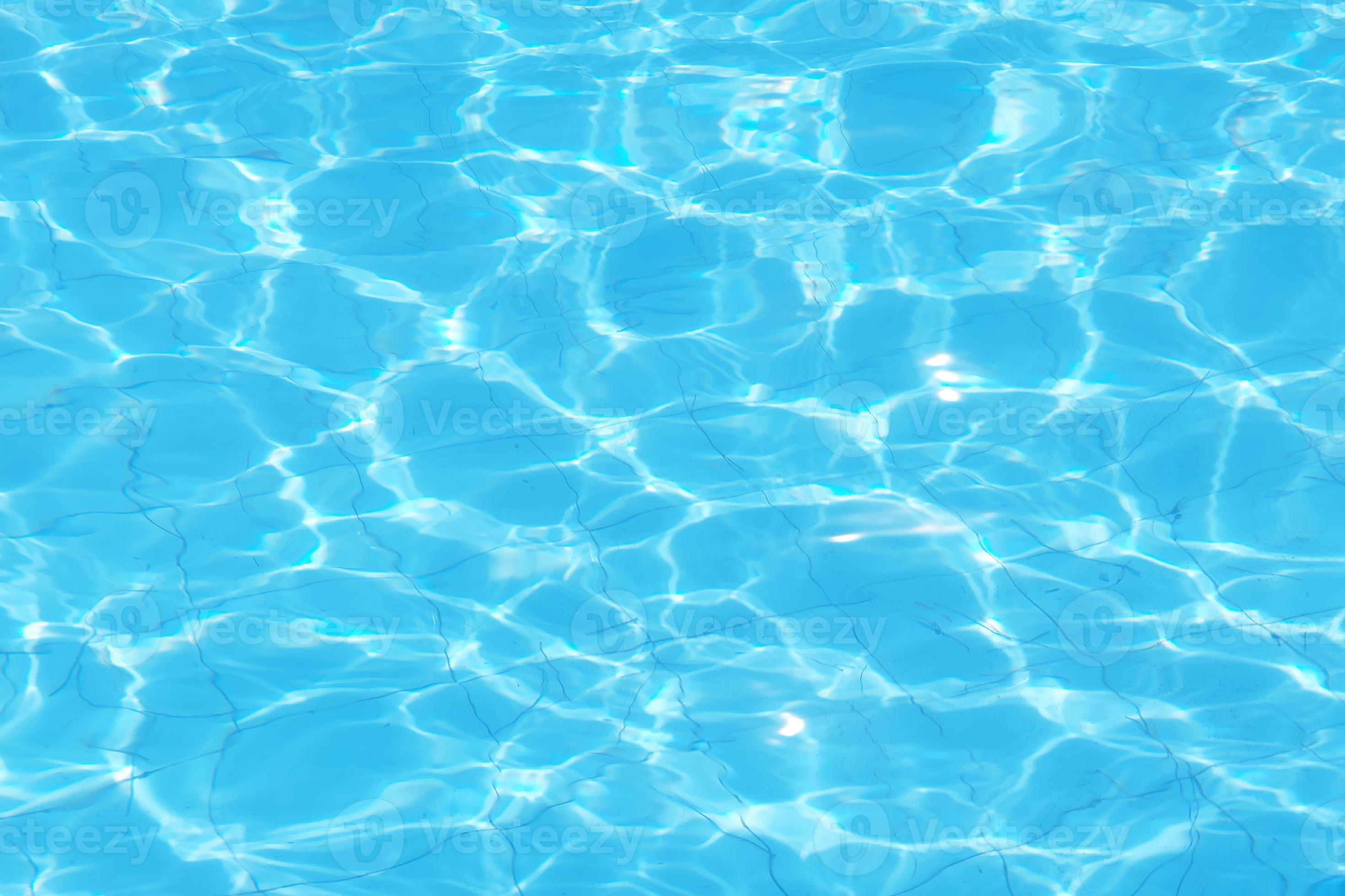 Defocus blurred transparent blue colored clear calm water surface texture  with splash, bubble. Shining blue water ripple background. Surface of water  in swimming pool. Tropical beach water background. 10757215 Stock Photo at