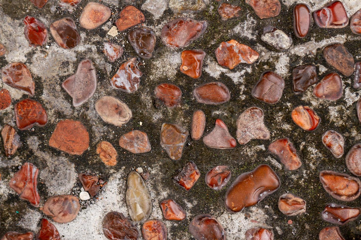 The arrangement of gravel mixed with cement used for pavement corridors in the garden, creates the impression of returning to nature, for a background with a nature theme photo