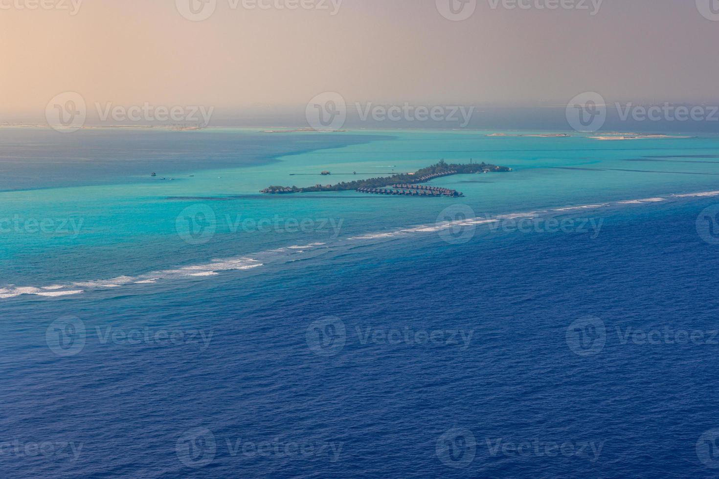 Maldives paradise sunset. Tropical aerial landscape, seascape island shore, boats water villas with amazing sea and lagoon beach, tropical nature. Exotic tourism destination banner, summer vacation photo