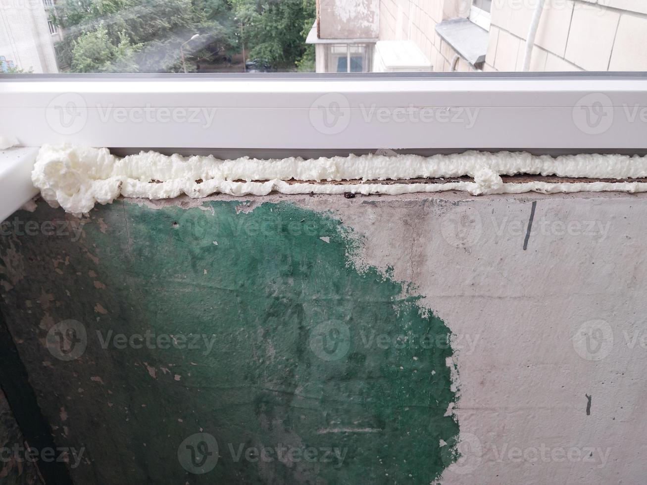 Installed metal-plastic windows on the balcony of a residential building photo