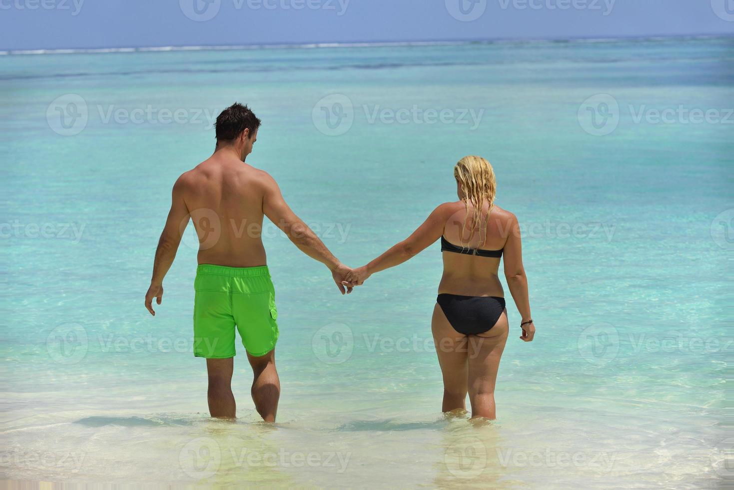 happy young  couple at summer vacation have fun and relax at beach photo
