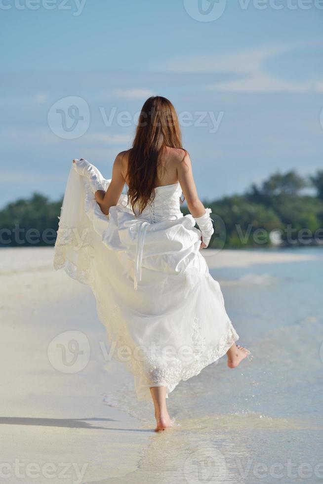 asian bride on beach photo