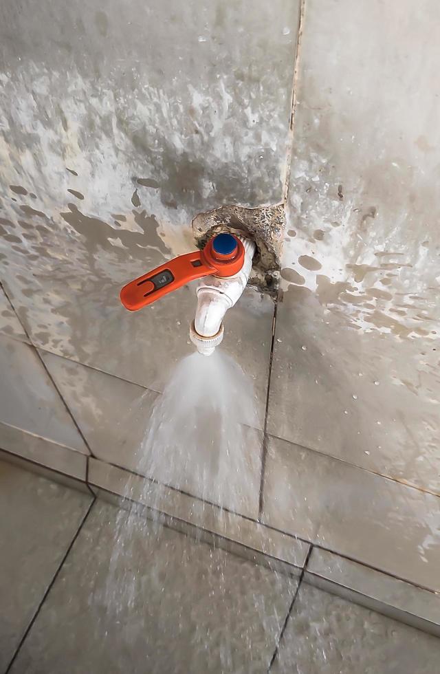 An open water faucet gives out very strong water photo