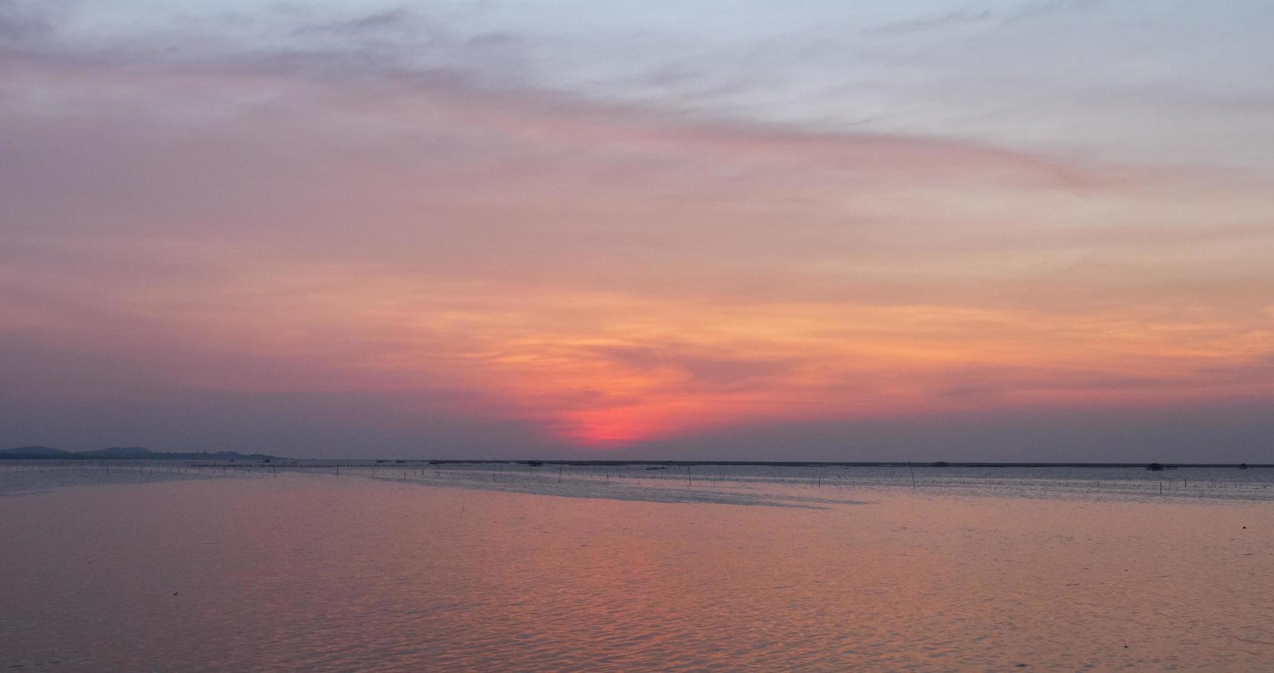 landscape viewpoint for design postcard and calendar summer sea wind wave cool on holiday calm sea coastal area big sunset sky light orange golden evening hours day At Chonburi Thailand photo