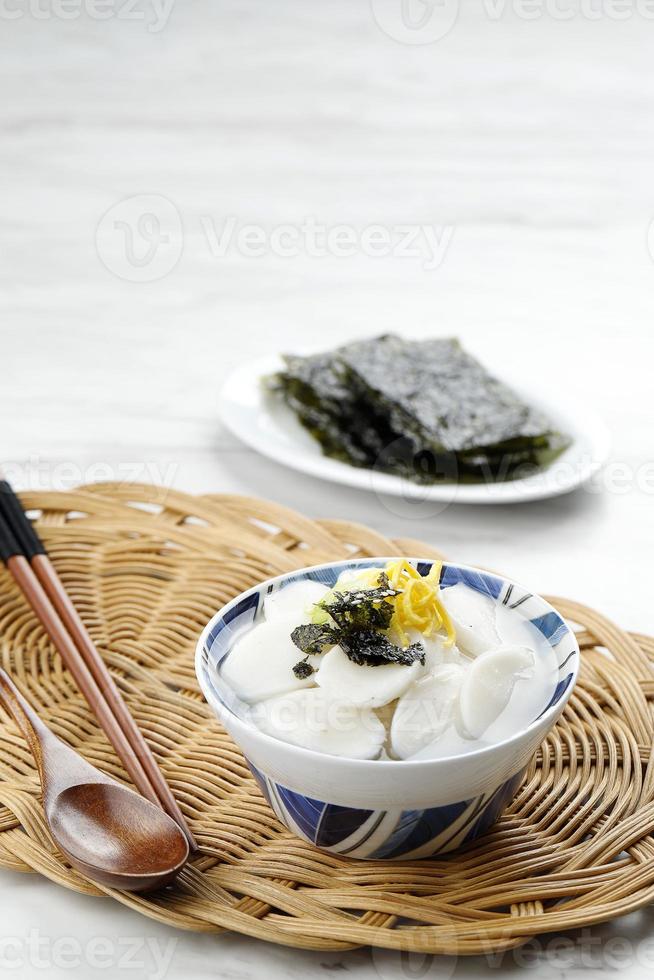 Tteokguk or Sliced Rice Cake Soup, Traditional Korean Dish Eaten During Celebration of the Korean New Year Seollal photo