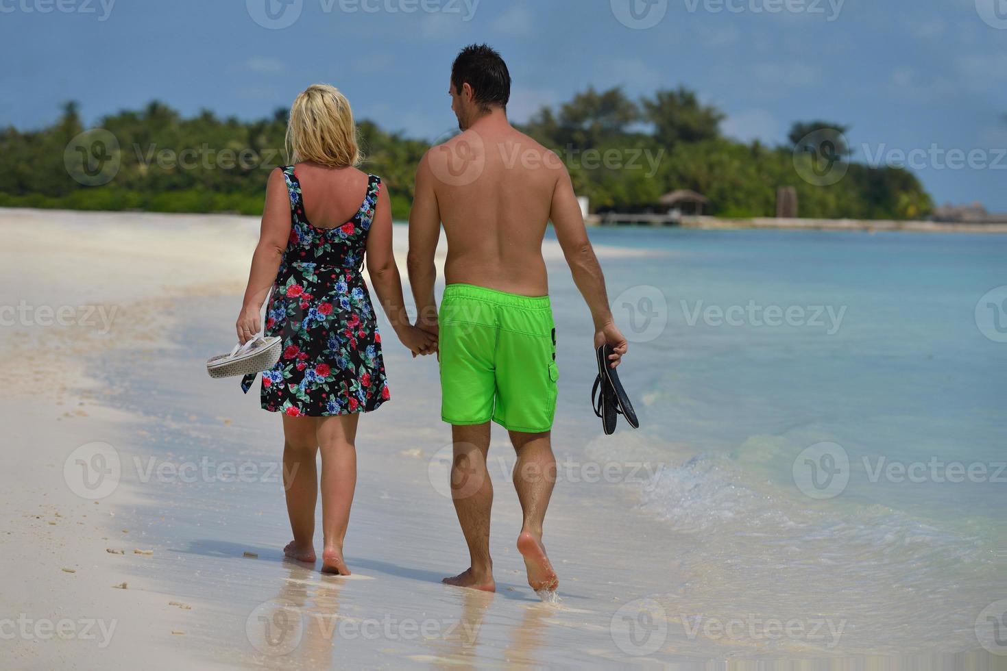 happy young  couple at summer vacation have fun and relax at beach photo