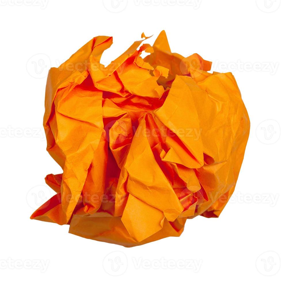 crumpled ball from orange paper isolated photo