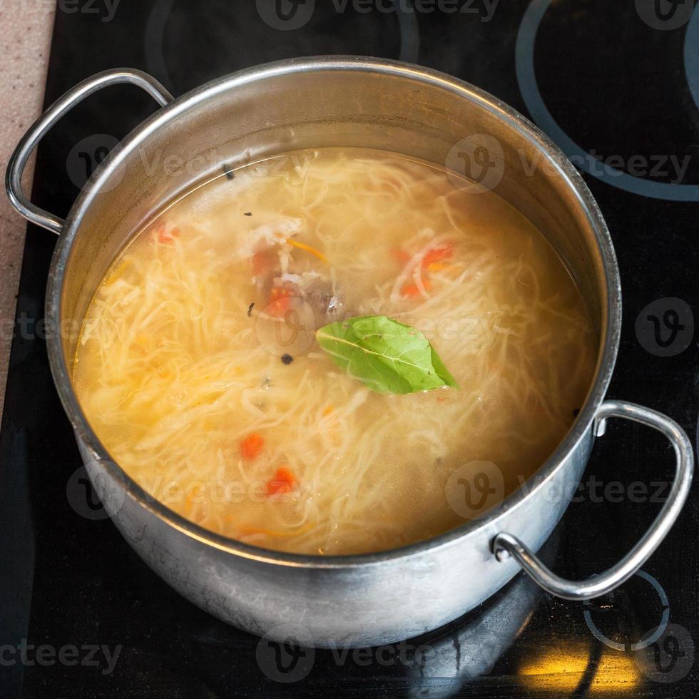 soup from stewed sour cabbage in stewpan photo