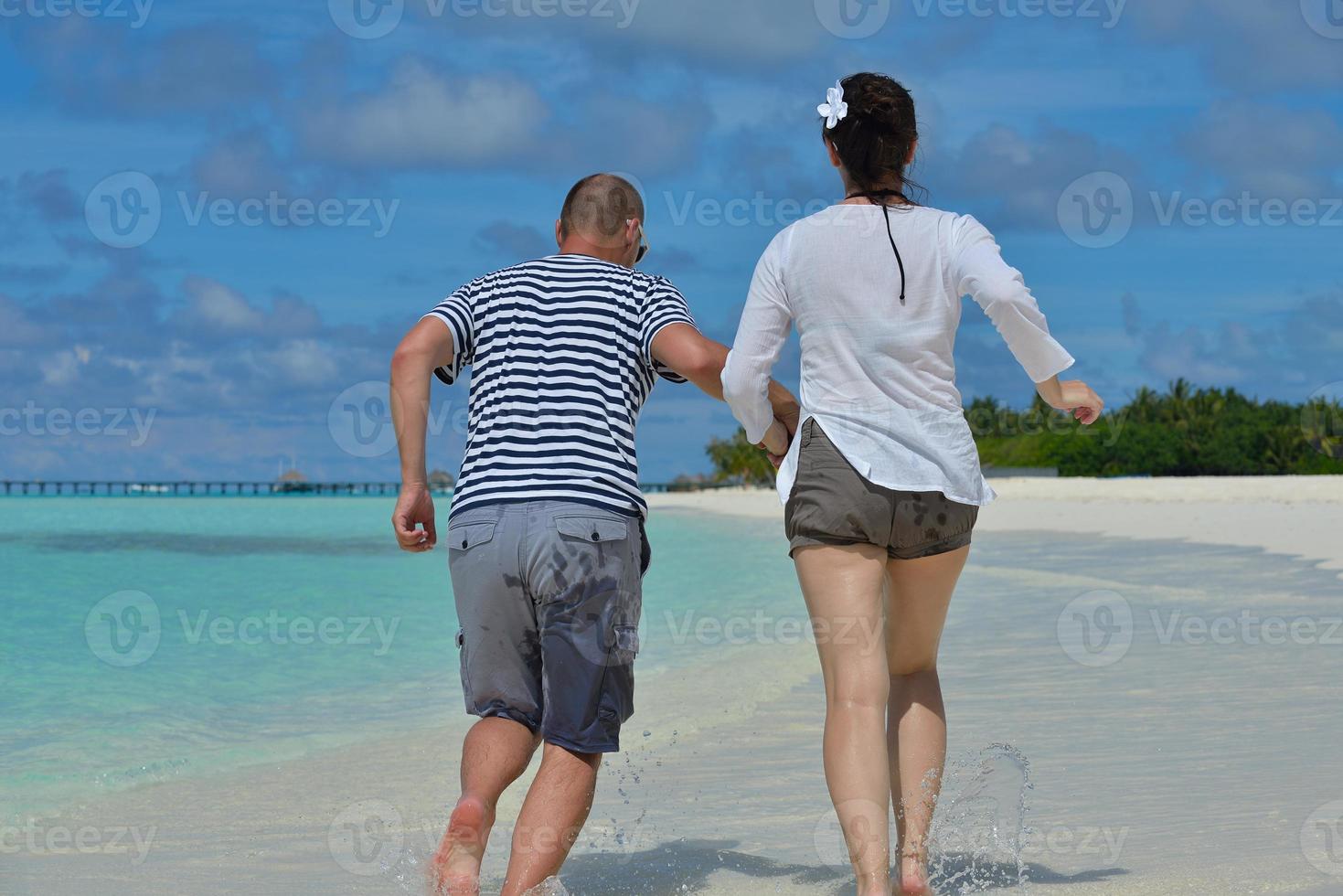 happy young  couple at summer vacation have fun and relax at beach photo