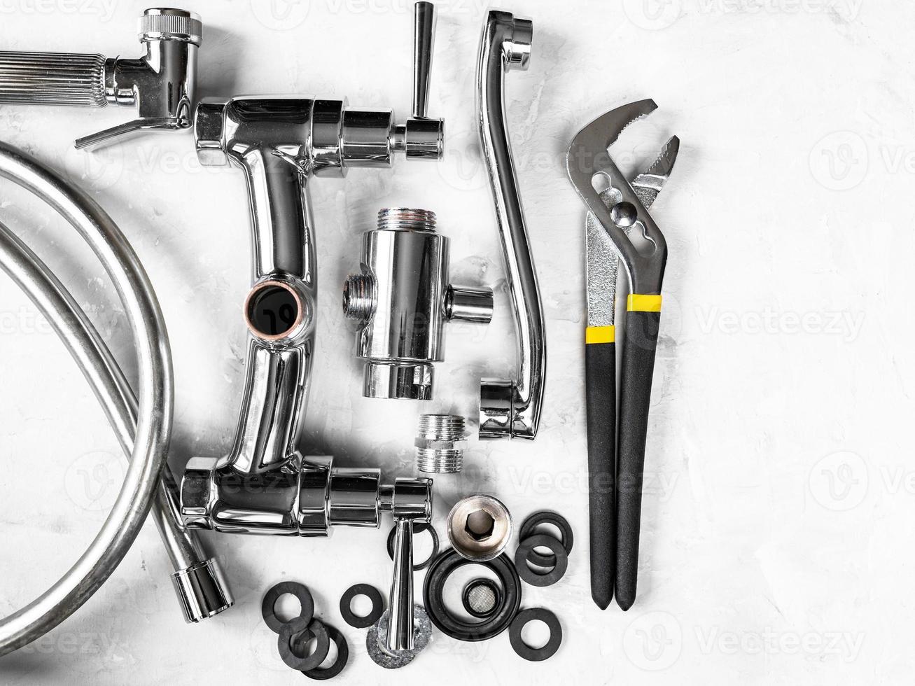 top of wrench, disassembled faucet with copyspace photo