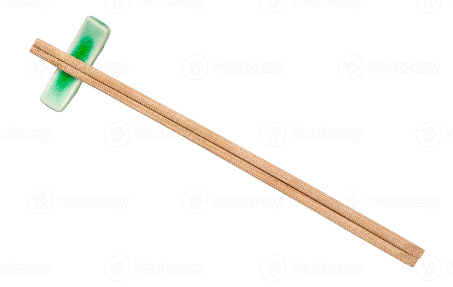 top view of brown wooden chopsticks on rest photo