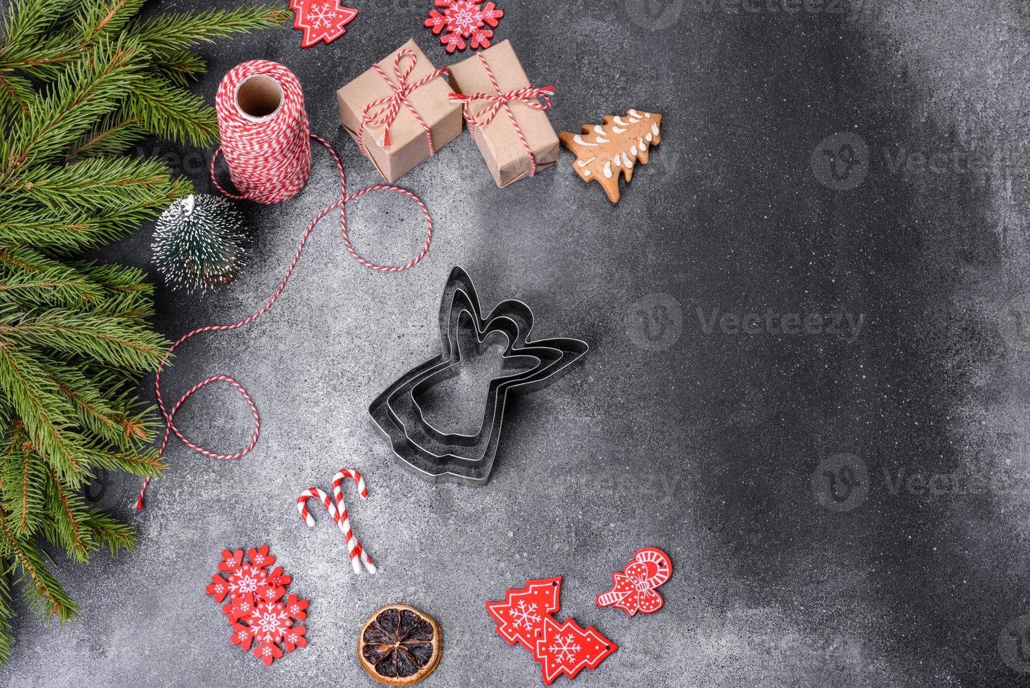 Gingerbread, Christmas tree decorations, dried citrus fruits on a gray concrete background photo