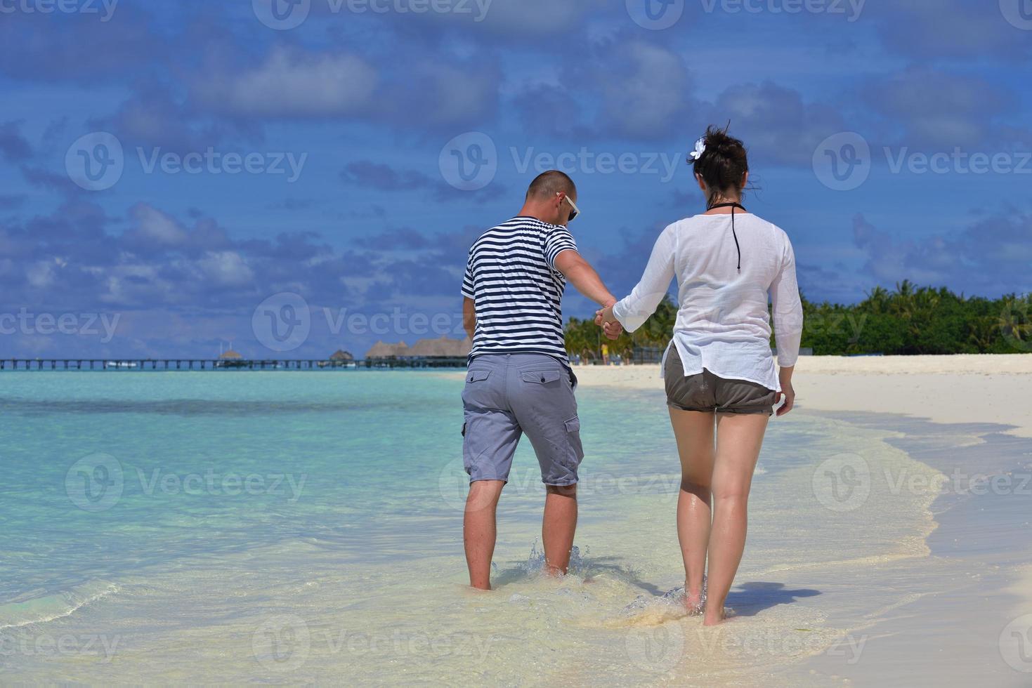 happy young  couple at summer vacation have fun and relax at beach photo