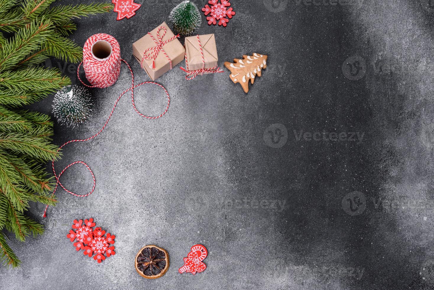 Gingerbread, Christmas tree decorations, dried citrus fruits on a gray concrete background photo