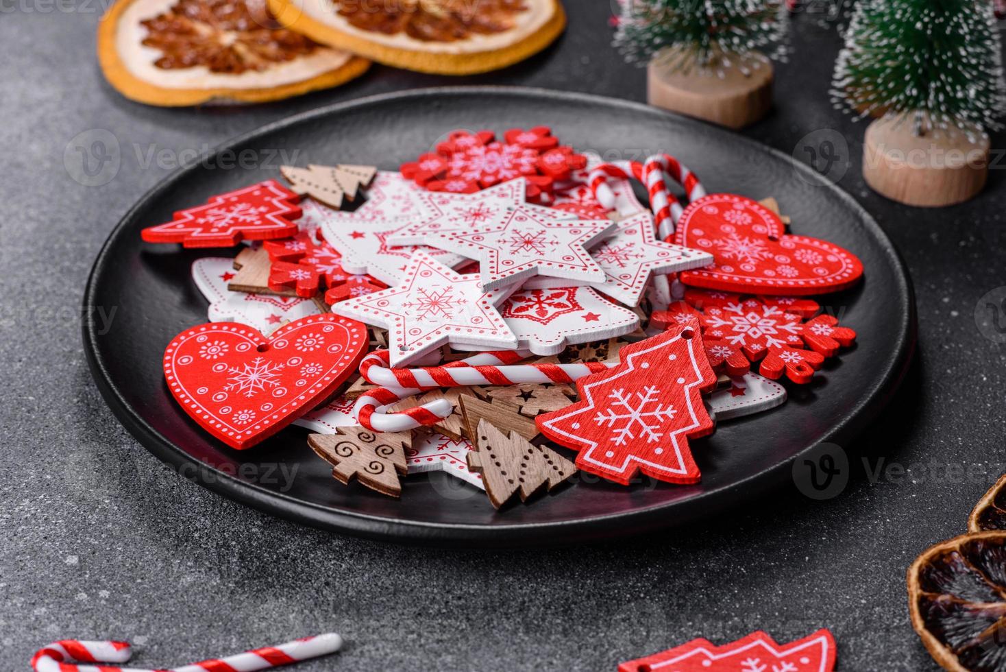 Gingerbread, Christmas tree decorations, dried citrus fruits on a gray concrete background photo