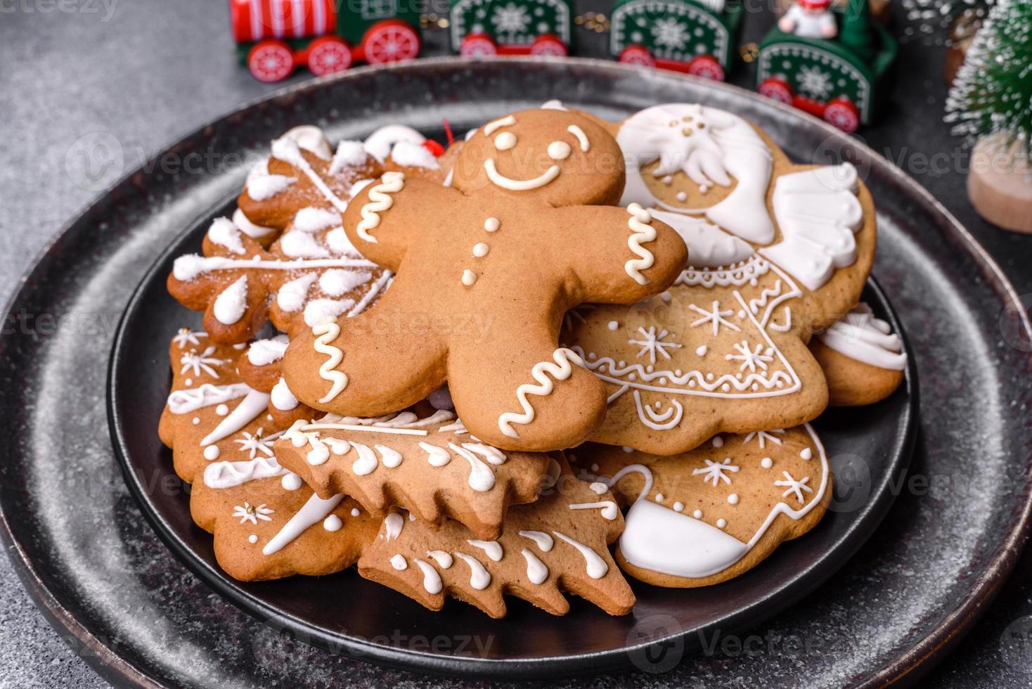 Gingerbread, Christmas tree decorations, dried citrus fruits on a gray concrete background photo