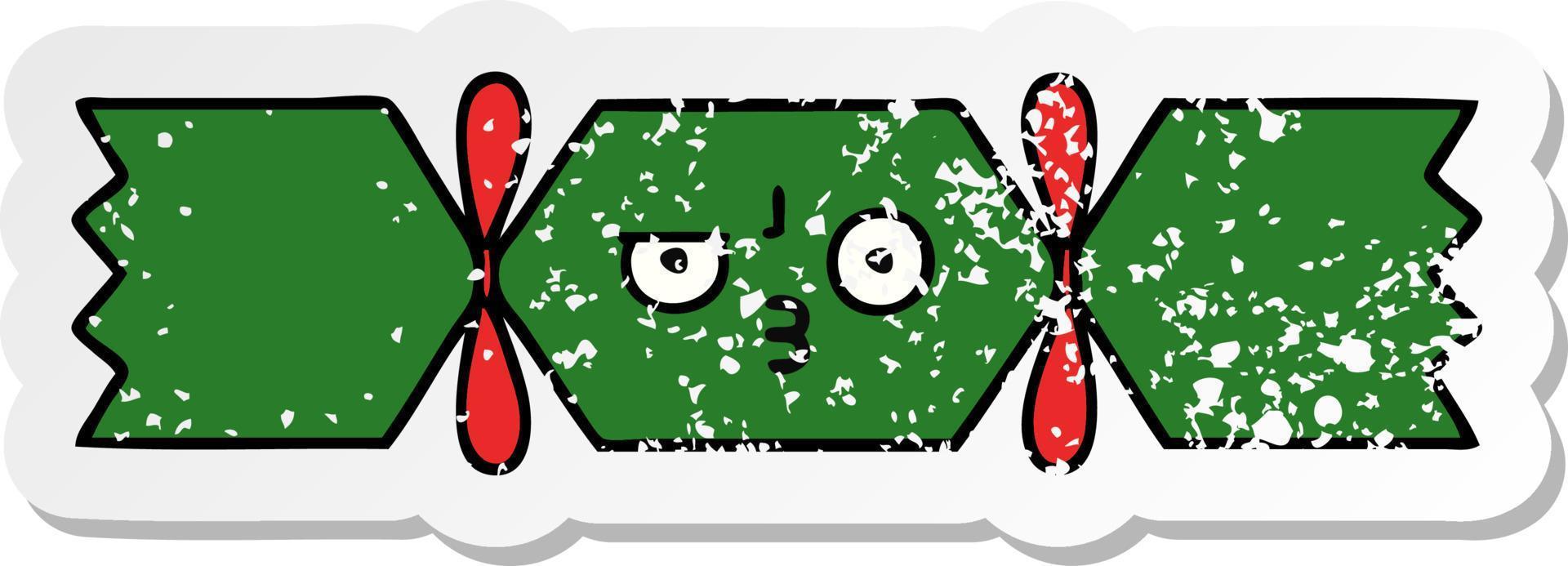 distressed sticker of a cute cartoon christmas cracker vector