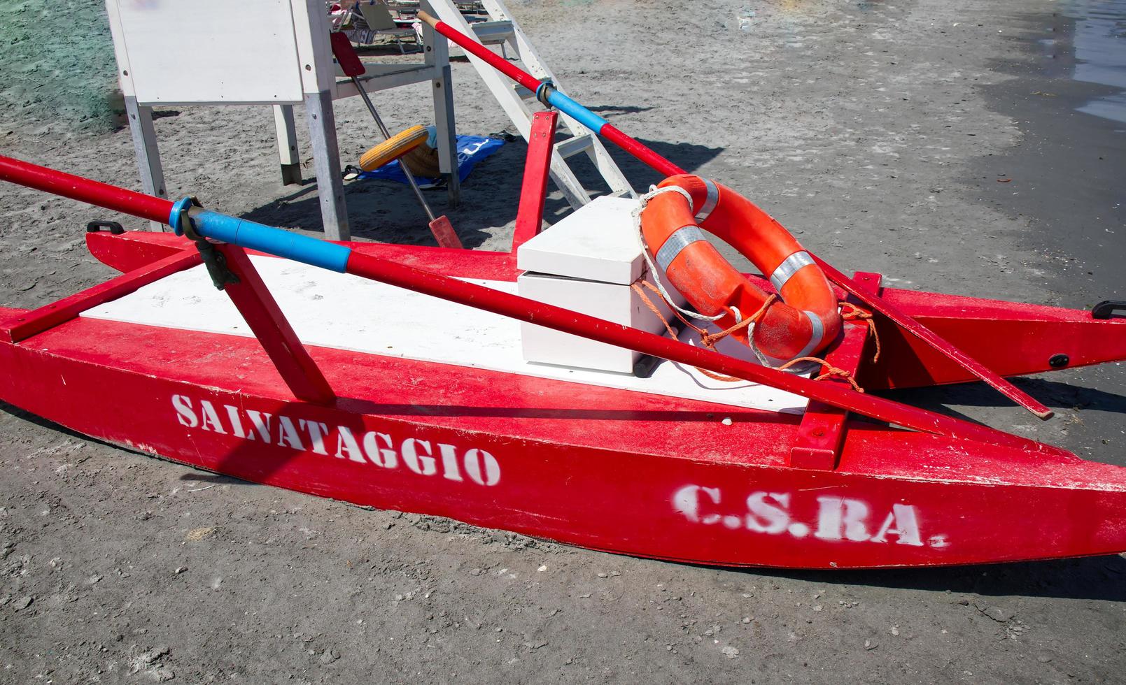 Red lifeguard rescue boat. The word Salvataggio, Rescue written on the boat. Riviera Romagnola, Italy photo