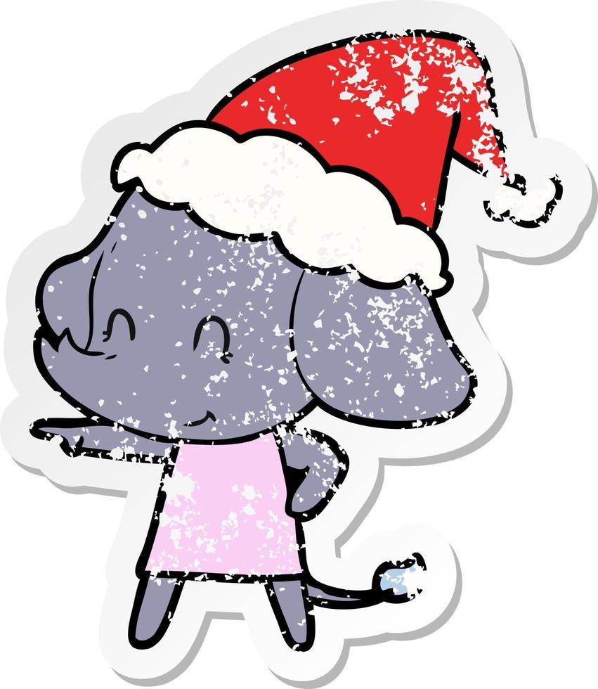 cute distressed sticker cartoon of a elephant wearing santa hat vector