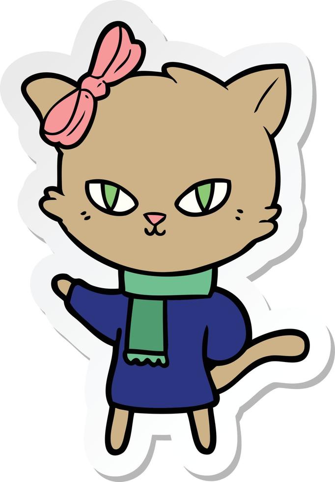 sticker of a cute cartoon cat in winter clothes vector