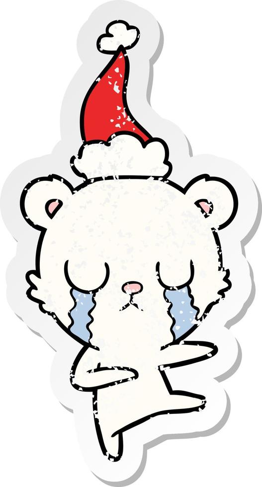 crying polar bear distressed sticker cartoon of a wearing santa hat vector