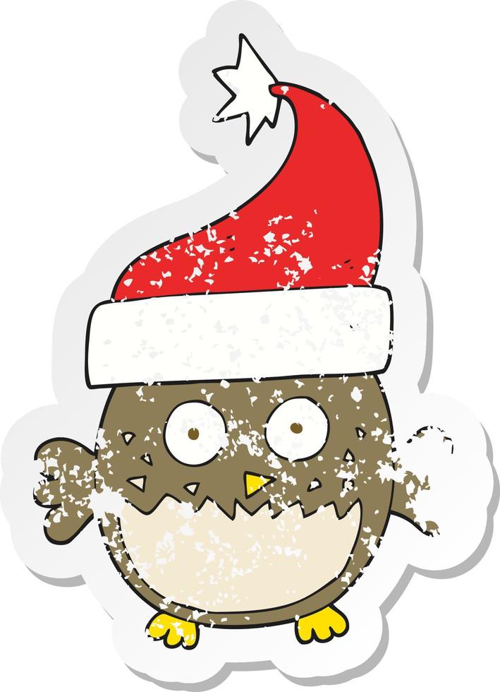 retro distressed sticker of a cartoon owl wearing christmas hat vector