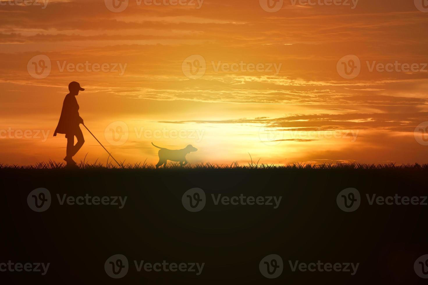 beautiful sunset with man walking photo