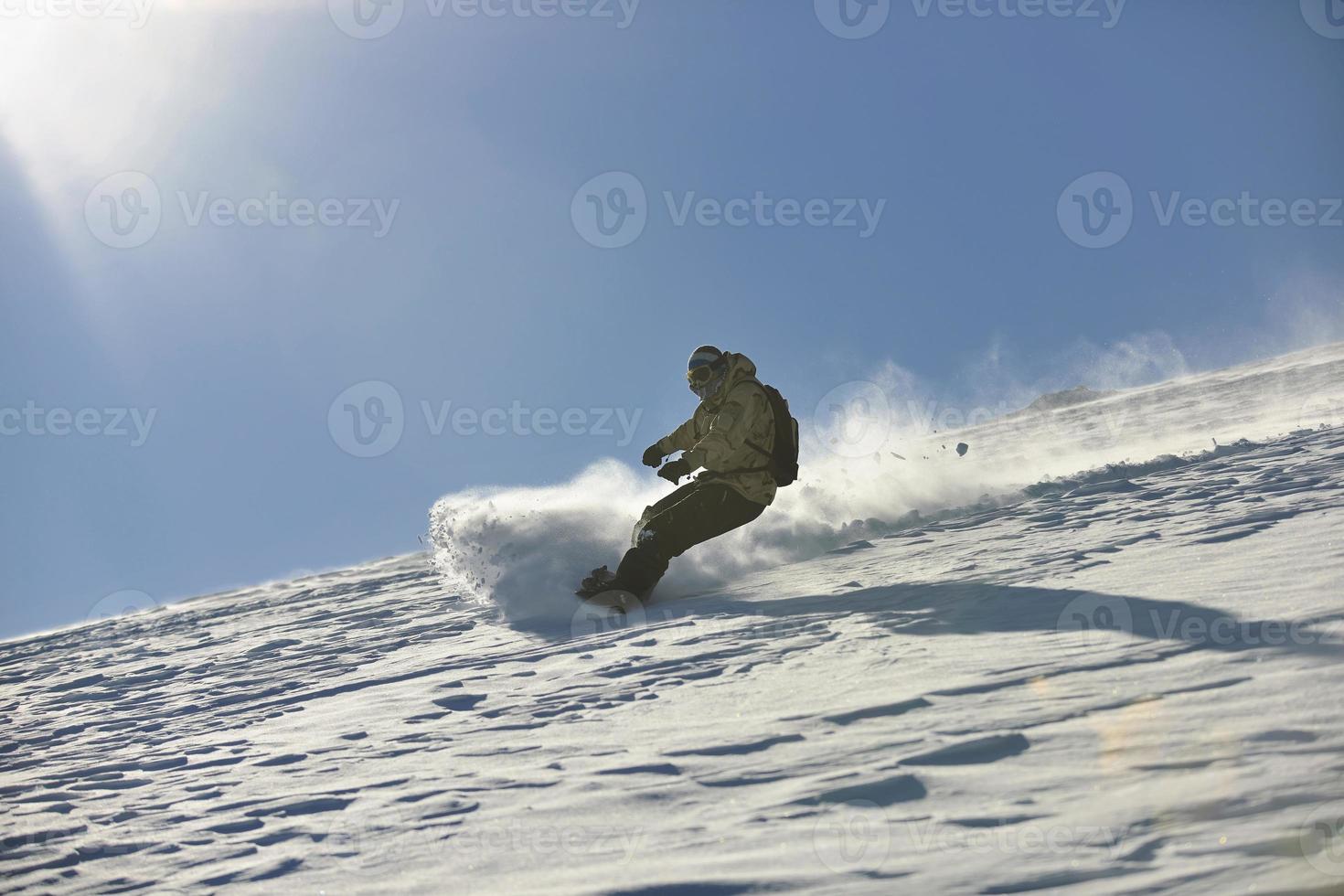 freestyle snowboarder jump and ride photo