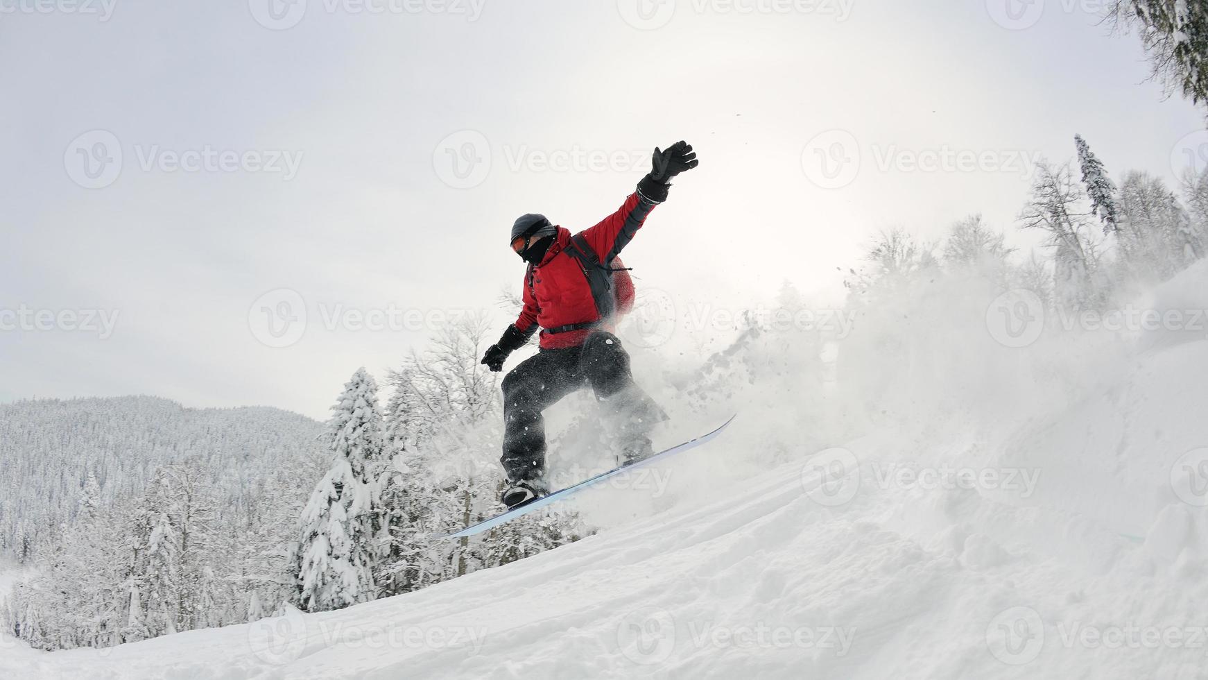 snowboarder on fresh deep snow photo