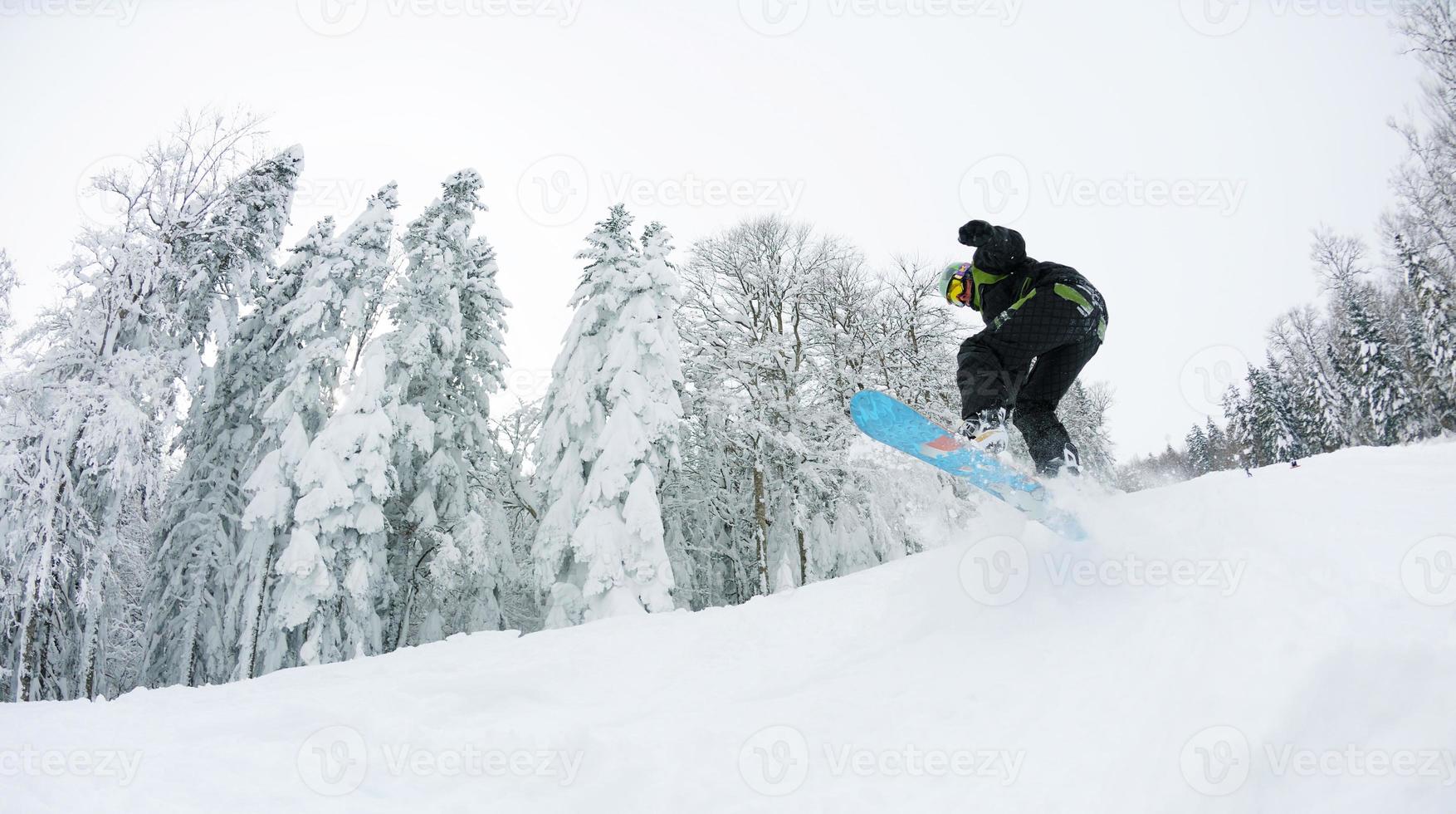 snowboarder on fresh deep snow photo