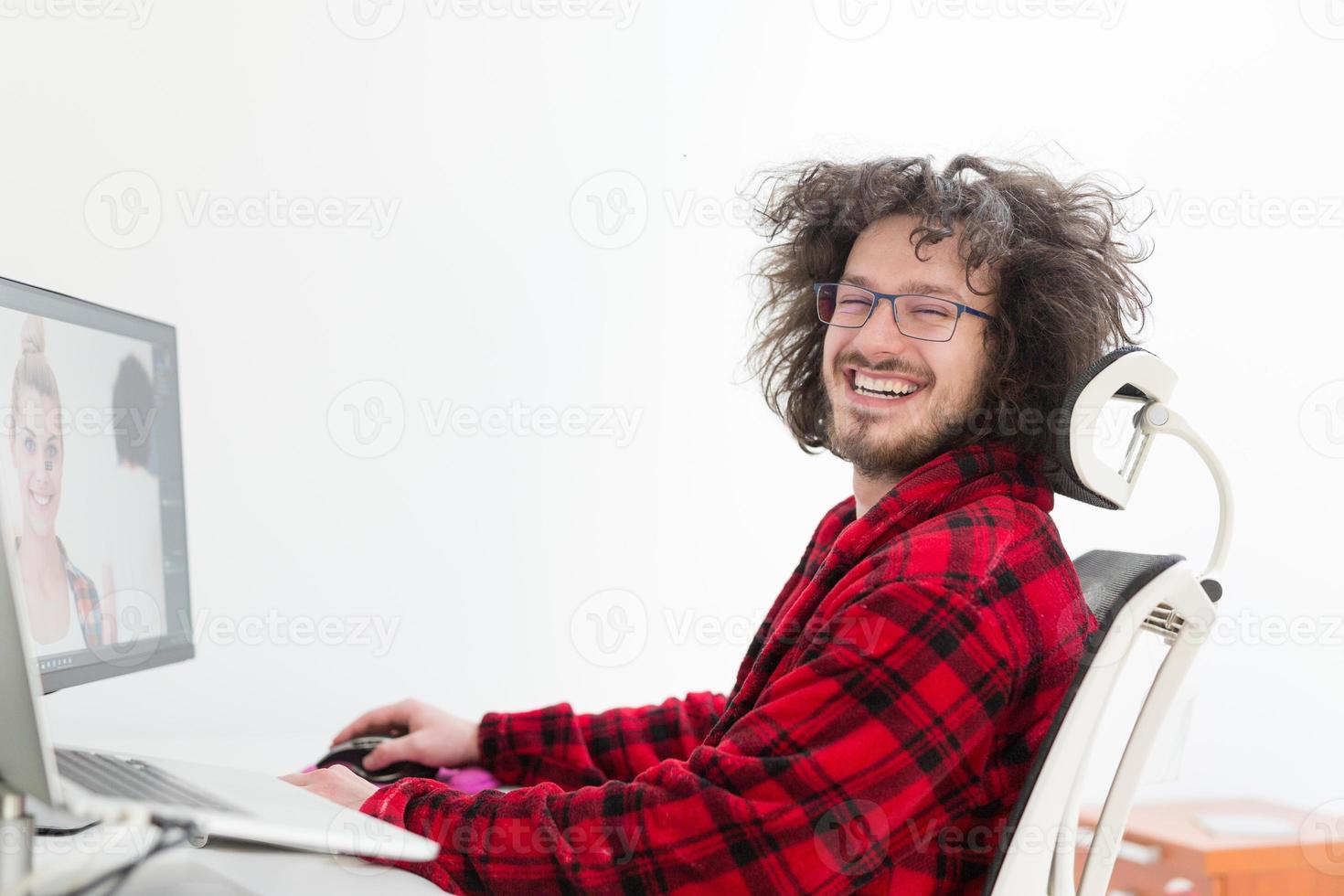 graphic designer in bathrobe working at home photo