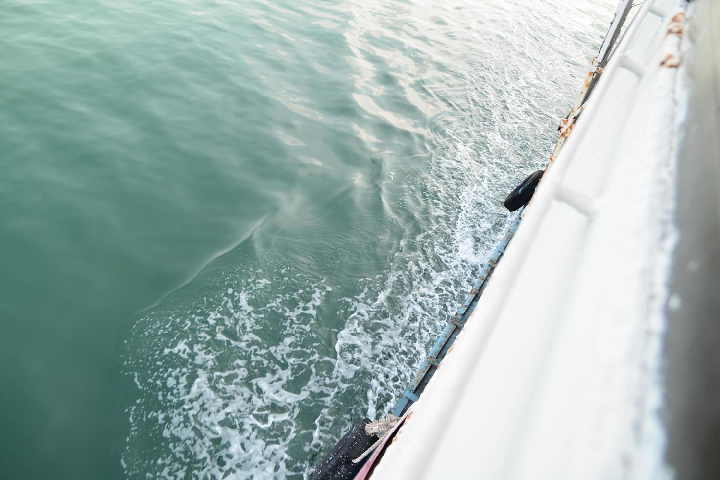 View of beside the stern wave of the ferry boat. Snap shot on boat view. photo