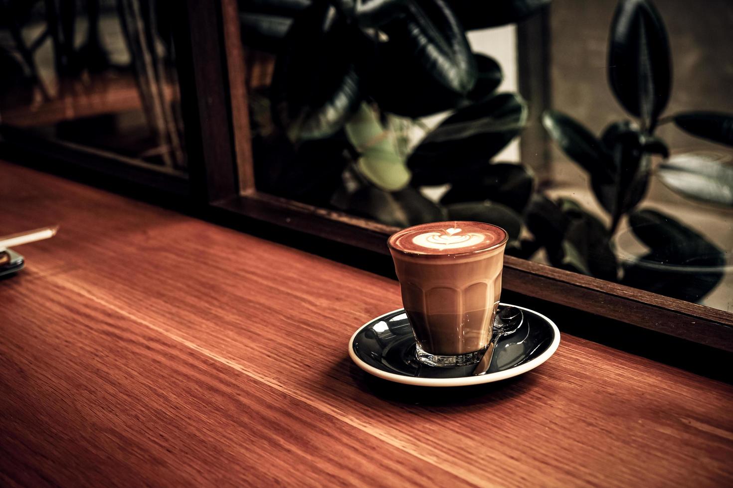 A cup of coffee latte top view with leaf shape foam 10768230 Stock
