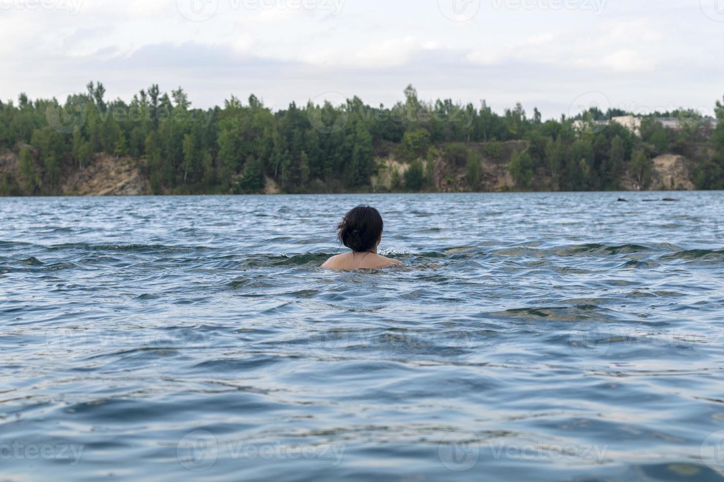 Portrait of a girl of Caucasian appearance in the lake. photo