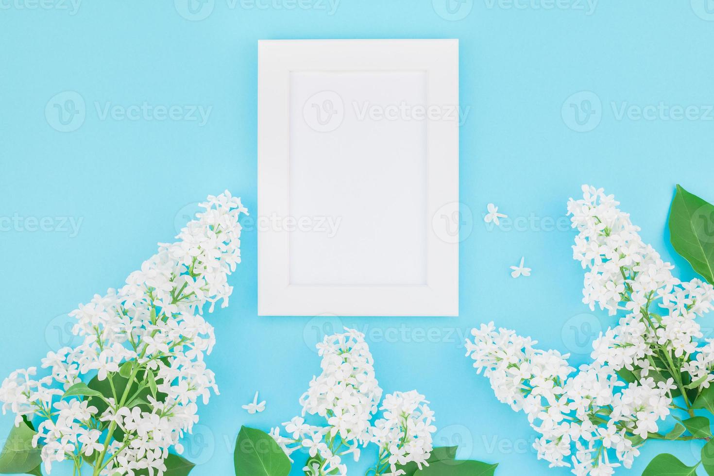 Blank frame mockup with white flowers photo