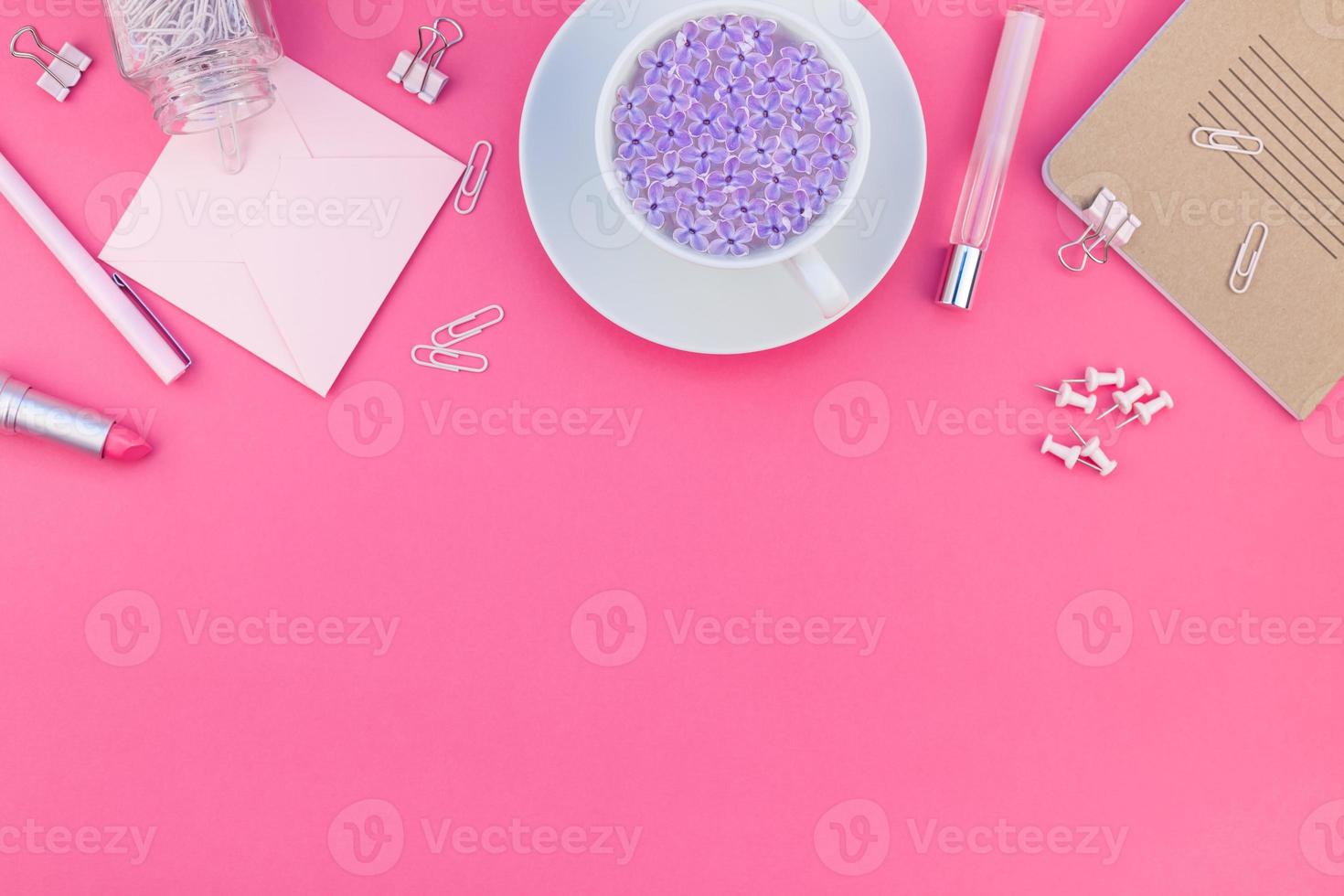 Styled pink feminine workspace flat lay photo
