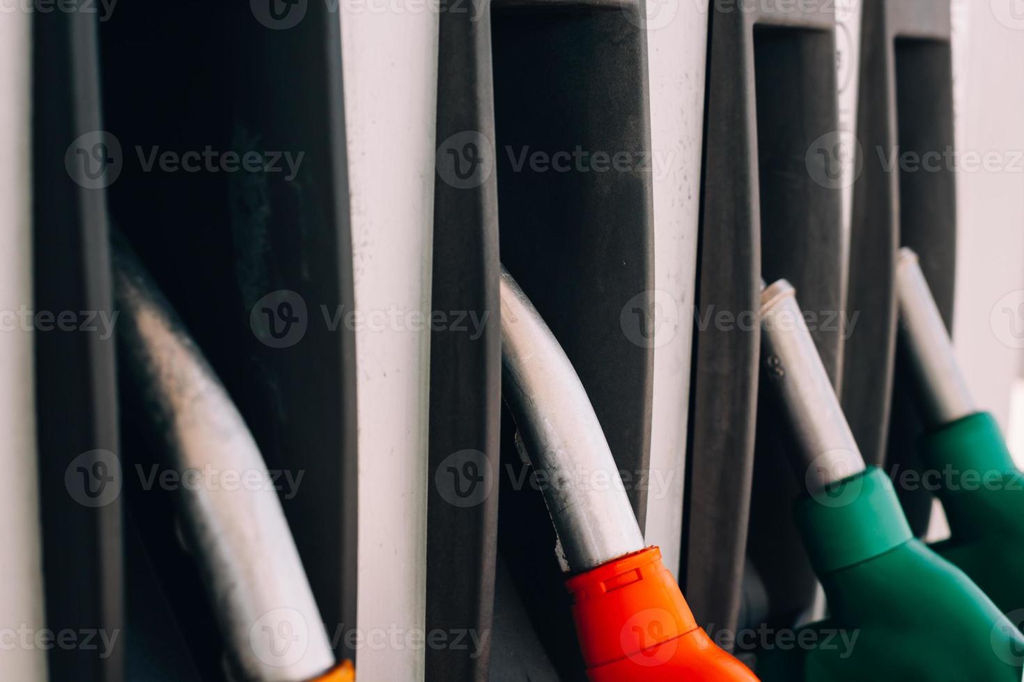 Petrol pump nozzles on a gas service station photo