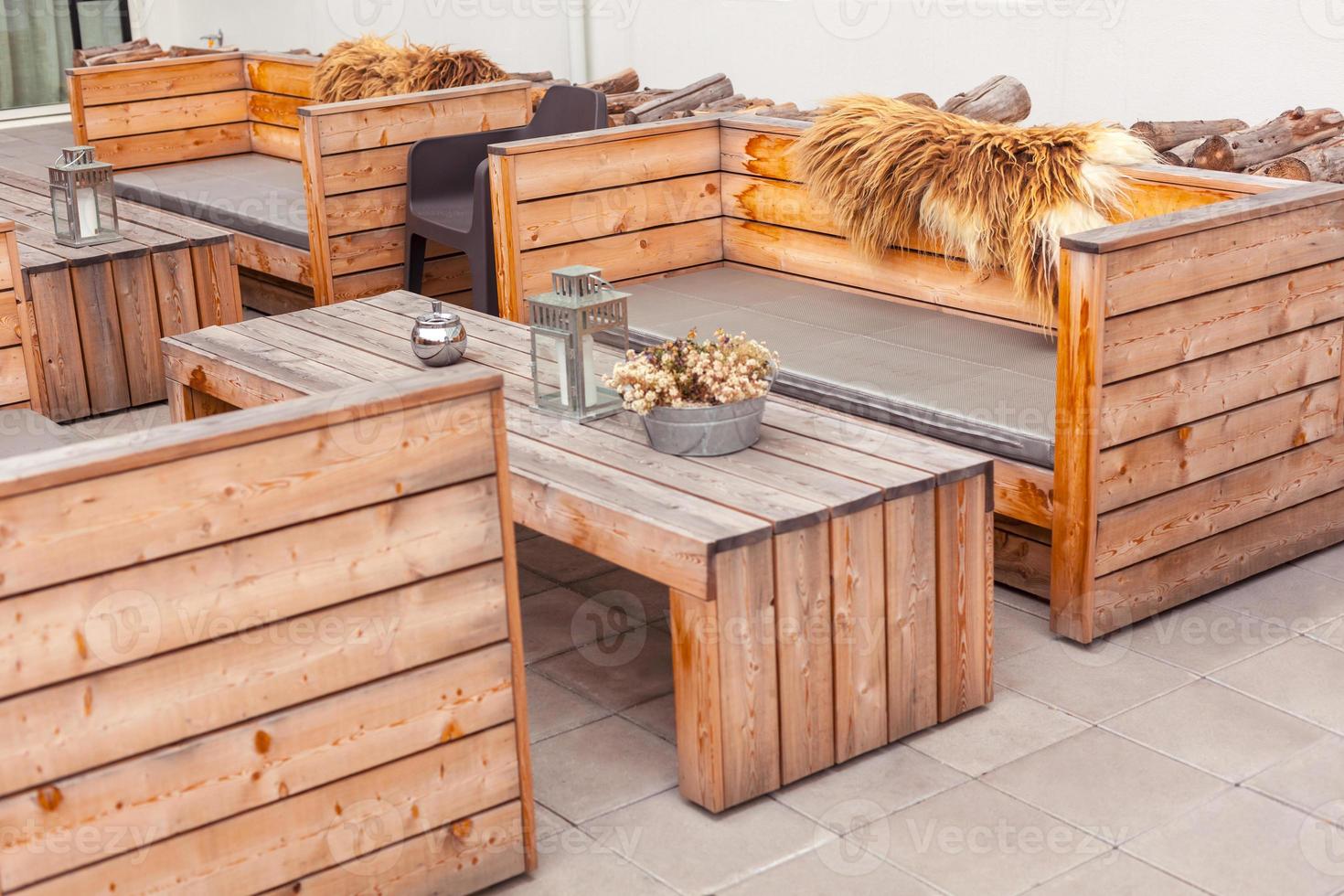 Outdoor restaurant terrace with wooden furniture photo