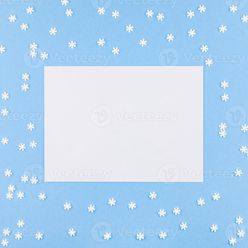 Winter pattern made of small white snowflakes photo