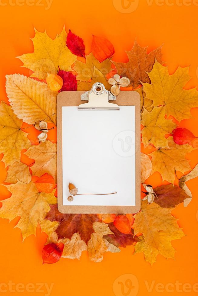 Autumn clipboard mockup with fall leaves photo